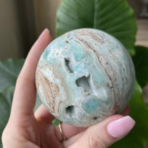 Shop Aragonite Stones & Crystals! Blue aragonite sphere, blue , orb, aragonite, fossil, minerals | Natural genuine stones & crystals in various shapes & sizes. Buy raw cut, tumbled, or polished gemstones for making jewelry or crystal healing energy vibration raising reiki stones. #crystals #gemstones #crystalhealing #crystalsandgemstones #energyhealing #affiliate #ad