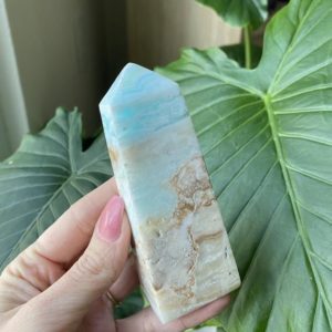 Shop Calcite Stones & Crystals! Blue Caribbean calcite tower | Natural genuine stones & crystals in various shapes & sizes. Buy raw cut, tumbled, or polished gemstones for making jewelry or crystal healing energy vibration raising reiki stones. #crystals #gemstones #crystalhealing #crystalsandgemstones #energyhealing #affiliate #ad