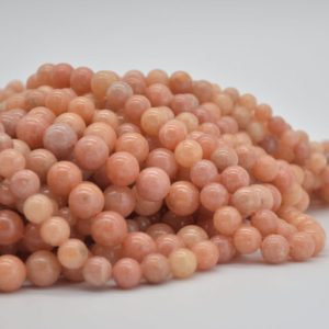 Shop Calcite Beads! Peach Calcite Round Beads – 6mm, 8mm, 10mm sizes – 14" Strand – Natural Semi-precious Gemstone | Natural genuine round Calcite beads for beading and jewelry making.  #jewelry #beads #beadedjewelry #diyjewelry #jewelrymaking #beadstore #beading #affiliate #ad