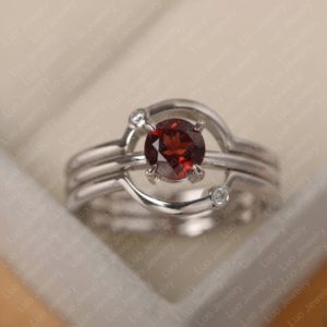 Shop Garnet Rings! Mars ring, round cut garnet promise ring,red gemstone ,sterling silver,bridal ring sets | Natural genuine Garnet rings, simple unique alternative gemstone engagement rings. #rings #jewelry #bridal #wedding #jewelryaccessories #engagementrings #weddingideas #affiliate #ad