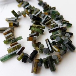 Shop Crystal Beads for Jewelry Making! 5-12mm Rare Green Tourmaline Faceted Pipe Bead, Natural Green Tourmaline Designer Fancy Sticks, Green Tourmaline For Jewelry (5.5IN To 11IN) | Natural genuine beads Quartz beads for beading and jewelry making.  #jewelry #beads #beadedjewelry #diyjewelry #jewelrymaking #beadstore #beading #affiliate #ad