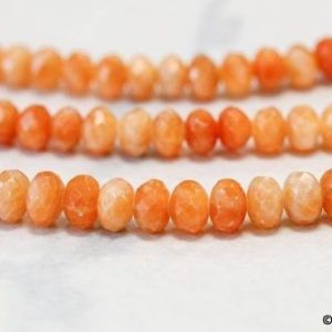 Shop Orange Calcite Beads! M/ Orange Calcite 10mm Faceted Rondelle Beads 15.5" strand Natural gemstone beads For jewelry making | Natural genuine faceted Orange Calcite beads for beading and jewelry making.  #jewelry #beads #beadedjewelry #diyjewelry #jewelrymaking #beadstore #beading #affiliate #ad