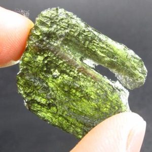 Shop Moldavite Stones & Crystals! Moldavite Tektite Raw Piece from Czech Republic – 1.2" – 35.00 Carats – 7.00 Grams | Natural genuine stones & crystals in various shapes & sizes. Buy raw cut, tumbled, or polished gemstones for making jewelry or crystal healing energy vibration raising reiki stones. #crystals #gemstones #crystalhealing #crystalsandgemstones #energyhealing #affiliate #ad