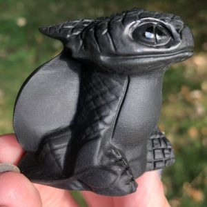 Shop Obsidian Shapes! Black Obsidian Toothless Dragon Carving  Crystal HTTYD Figurine #2 | Natural genuine stones & crystals in various shapes & sizes. Buy raw cut, tumbled, or polished gemstones for making jewelry or crystal healing energy vibration raising reiki stones. #crystals #gemstones #crystalhealing #crystalsandgemstones #energyhealing #affiliate #ad