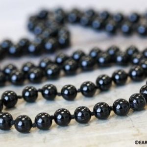 Shop Onyx Necklaces! M/ 32"-36" Long Beaded Necklace w/ Black Onyx 6mm/ 10mm Smooth Round beads knotted loop strand Everlasting classic black onyx necklace | Natural genuine Onyx necklaces. Buy crystal jewelry, handmade handcrafted artisan jewelry for women.  Unique handmade gift ideas. #jewelry #beadednecklaces #beadedjewelry #gift #shopping #handmadejewelry #fashion #style #product #necklaces #affiliate #ad