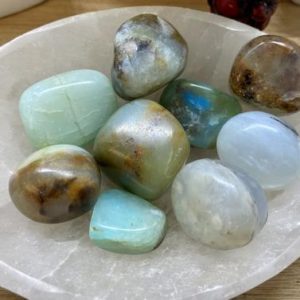 Shop Tumbled Opal Crystals & Pocket Stones! Tumbled Blue Opal stone crystal polished geode healing | Natural genuine stones & crystals in various shapes & sizes. Buy raw cut, tumbled, or polished gemstones for making jewelry or crystal healing energy vibration raising reiki stones. #crystals #gemstones #crystalhealing #crystalsandgemstones #energyhealing #affiliate #ad