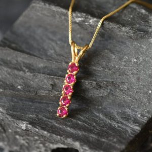 Shop Ruby Pendants! Gold Ruby Pendant, Created Ruby, Vertical Pendant, Bar Pendant, Drop Pendant, Minimalist Necklace, Line Pendant, Dainty Pendant, Vermeil | Natural genuine Ruby pendants. Buy crystal jewelry, handmade handcrafted artisan jewelry for women.  Unique handmade gift ideas. #jewelry #beadedpendants #beadedjewelry #gift #shopping #handmadejewelry #fashion #style #product #pendants #affiliate #ad