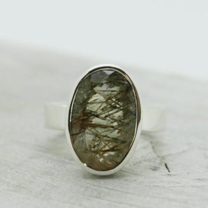Shop Rutilated Quartz Rings! A beauty…Green rutile quartz ring natural rutilated quartz stone cut oval shape sterling silver 925 solid silver amazing quality ring | Natural genuine Rutilated Quartz rings, simple unique handcrafted gemstone rings. #rings #jewelry #shopping #gift #handmade #fashion #style #affiliate #ad