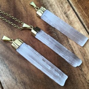Shop Selenite Necklaces! Raw Selenite Pendant in Gold Colored Metal – Selenite Necklace – Selenite Jewelry – Healing Crystal Necklace – Raw Natural Selenite Pendant | Natural genuine Selenite necklaces. Buy crystal jewelry, handmade handcrafted artisan jewelry for women.  Unique handmade gift ideas. #jewelry #beadednecklaces #beadedjewelry #gift #shopping #handmadejewelry #fashion #style #product #necklaces #affiliate #ad