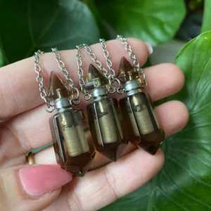 Shop Smoky Quartz Necklaces! Smoky quartz bottle necklace, Stash Necklace, Container Necklace, Urn Necklace, Cremation Necklace, crystal, gemstone, perfume bottle | Natural genuine Smoky Quartz necklaces. Buy crystal jewelry, handmade handcrafted artisan jewelry for women.  Unique handmade gift ideas. #jewelry #beadednecklaces #beadedjewelry #gift #shopping #handmadejewelry #fashion #style #product #necklaces #affiliate #ad