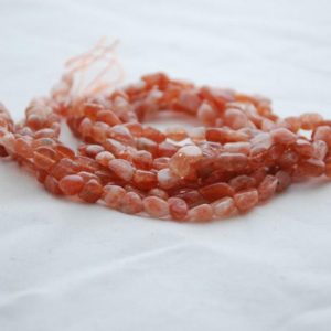 Shop Sunstone Chip & Nugget Beads! High Quality Grade A Natural Sunstone Semi-Precious Gemstone Tumbled Stone Nugget Pebble Beads – approx 5mm – 8mm – 15.5" strand | Natural genuine chip Sunstone beads for beading and jewelry making.  #jewelry #beads #beadedjewelry #diyjewelry #jewelrymaking #beadstore #beading #affiliate #ad