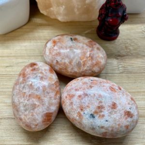 Shop Tumbled Sunstone Crystals & Pocket Stones! Premium Sunstone Palm Stones polished tumbled | Natural genuine stones & crystals in various shapes & sizes. Buy raw cut, tumbled, or polished gemstones for making jewelry or crystal healing energy vibration raising reiki stones. #crystals #gemstones #crystalhealing #crystalsandgemstones #energyhealing #affiliate #ad