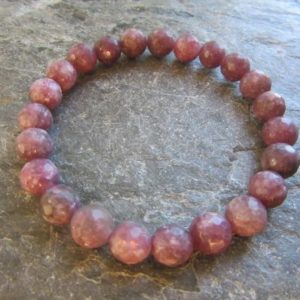 Shop Lepidolite Bracelets! The balancing and calming bracelet faceted! Handmade stretch bracelet natural light purple lepidolite faceted 8mm Reiki infused | Natural genuine Lepidolite bracelets. Buy crystal jewelry, handmade handcrafted artisan jewelry for women.  Unique handmade gift ideas. #jewelry #beadedbracelets #beadedjewelry #gift #shopping #handmadejewelry #fashion #style #product #bracelets #affiliate #ad