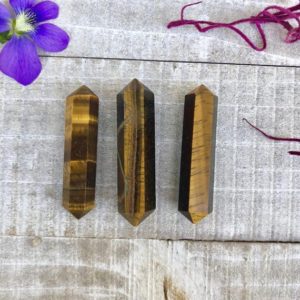 Shop Tiger Eye Points & Wands! Tigers Eye Double Terminated Crystals | Natural genuine stones & crystals in various shapes & sizes. Buy raw cut, tumbled, or polished gemstones for making jewelry or crystal healing energy vibration raising reiki stones. #crystals #gemstones #crystalhealing #crystalsandgemstones #energyhealing #affiliate #ad