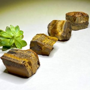 Shop Tiger Eye Stones & Crystals! Raw Tigers Eye Gemstones | Natural genuine stones & crystals in various shapes & sizes. Buy raw cut, tumbled, or polished gemstones for making jewelry or crystal healing energy vibration raising reiki stones. #crystals #gemstones #crystalhealing #crystalsandgemstones #energyhealing #affiliate #ad