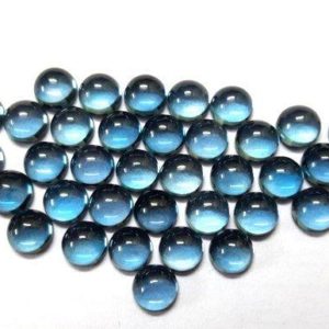 Shop Topaz Cabochons! 10 piece 3mm London Blue Topaz Cabochon Round Loose Gemstone, London Blue Topaz Round Cabochon gemstone, London Blue Topaz Cabochon Gemstone | Natural genuine stones & crystals in various shapes & sizes. Buy raw cut, tumbled, or polished gemstones for making jewelry or crystal healing energy vibration raising reiki stones. #crystals #gemstones #crystalhealing #crystalsandgemstones #energyhealing #affiliate #ad