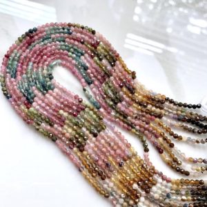 Shop Tourmaline Round Beads! 1/2 strand of tourmaline round | Natural genuine round Tourmaline beads for beading and jewelry making.  #jewelry #beads #beadedjewelry #diyjewelry #jewelrymaking #beadstore #beading #affiliate #ad