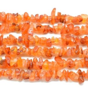 Shop Carnelian Chip & Nugget Beads! Carnelian Smooth Uncut Chips 34" Carnelian Beads Orange Carnelian Chips Raw Gemstone Orange Carnelian Uncut Beads, Carnelian Gemstone | Natural genuine chip Carnelian beads for beading and jewelry making.  #jewelry #beads #beadedjewelry #diyjewelry #jewelrymaking #beadstore #beading #affiliate #ad