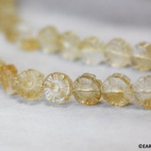 Shop Citrine Bead Shapes! M/ Citrine 10mm Carved Flower Coin beads 15.5" strand Yellow quartz beads routinely enhanced for jewelry making Shade varies | Natural genuine other-shape Citrine beads for beading and jewelry making.  #jewelry #beads #beadedjewelry #diyjewelry #jewelrymaking #beadstore #beading #affiliate #ad