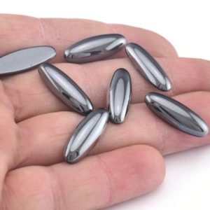 Hematite Cabochon 22x8mm Flat Back Cabochons 180CB Cab121-01 | Natural genuine stones & crystals in various shapes & sizes. Buy raw cut, tumbled, or polished gemstones for making jewelry or crystal healing energy vibration raising reiki stones. #crystals #gemstones #crystalhealing #crystalsandgemstones #energyhealing #affiliate #ad