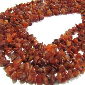 Shop Carnelian Chip & Nugget Beads! Natural Carnelian Irregular Chip Gravel Uncut Nugget Shape Plain 4mm To 8mm Jewelry Making Beads Strand 34 Inches Long Sold Per Strand | Natural genuine chip Carnelian beads for beading and jewelry making.  #jewelry #beads #beadedjewelry #diyjewelry #jewelrymaking #beadstore #beading #affiliate #ad