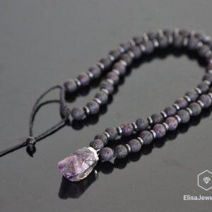 Shop Hematite Jewelry! Natural Crystal Raw Amethyst Black Lava Hematite Beads Macrame Adjustable Beaded Long Necklace Healing Gemstone Protection Christmas Gift | Natural genuine Hematite jewelry. Buy crystal jewelry, handmade handcrafted artisan jewelry for women.  Unique handmade gift ideas. #jewelry #beadedjewelry #beadedjewelry #gift #shopping #handmadejewelry #fashion #style #product #jewelry #affiliate #ad