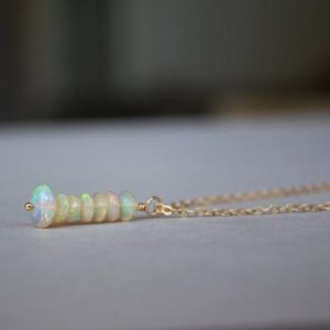 Shop Opal Necklaces! Ethiopian Opal Necklace, Opal Bar Necklace, Genuine Opal Necklace Gold Filled, Sterling Silver, Rose Gold, Fire Opal Necklace, Opal Bead | Natural genuine Opal necklaces. Buy crystal jewelry, handmade handcrafted artisan jewelry for women.  Unique handmade gift ideas. #jewelry #beadednecklaces #beadedjewelry #gift #shopping #handmadejewelry #fashion #style #product #necklaces #affiliate #ad
