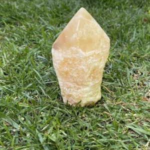 Shop Orange Calcite Points & Wands! Orange Calcite Point | Natural genuine stones & crystals in various shapes & sizes. Buy raw cut, tumbled, or polished gemstones for making jewelry or crystal healing energy vibration raising reiki stones. #crystals #gemstones #crystalhealing #crystalsandgemstones #energyhealing #affiliate #ad