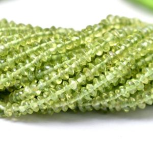 Shop Peridot Rondelle Beads! AAA+ Peridot 3mm Button Rondelle Smooth Beads | 13inch Strand | Natural Green Peridot Semi Precious Gemstone Saucer Beads for Jewelry Making | Natural genuine rondelle Peridot beads for beading and jewelry making.  #jewelry #beads #beadedjewelry #diyjewelry #jewelrymaking #beadstore #beading #affiliate #ad