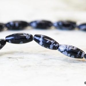 Shop Snowflake Obsidian Beads! S/ Snowflake Obsidian 5x12mm/ 4x6mm Oval Rice Beads; Approx. 15.5 inches long; Black and White Gemstone Oval beads | Natural genuine beads Snowflake Obsidian beads for beading and jewelry making.  #jewelry #beads #beadedjewelry #diyjewelry #jewelrymaking #beadstore #beading #affiliate #ad