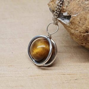Shop Tiger Eye Pendants! Minimalist Tigers eye circle pendant necklace. 925 sterling silver. Crystal Reiki jewelry. Capricorn jewelry uk. 10mm tiger eye stone | Natural genuine Tiger Eye pendants. Buy crystal jewelry, handmade handcrafted artisan jewelry for women.  Unique handmade gift ideas. #jewelry #beadedpendants #beadedjewelry #gift #shopping #handmadejewelry #fashion #style #product #pendants #affiliate #ad