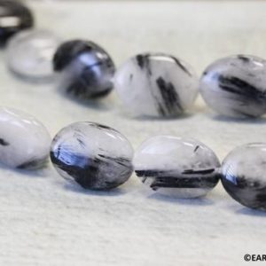 L-M/ Tourmalinated Quartz 15x20mm/ 13x18mm Flat Oval beads 15" strand Natural black and white quartz beads for jewelry making | Natural genuine other-shape Gemstone beads for beading and jewelry making.  #jewelry #beads #beadedjewelry #diyjewelry #jewelrymaking #beadstore #beading #affiliate #ad