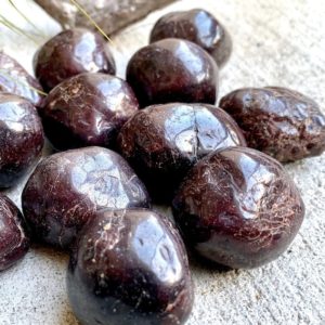 Shop Garnet Stones & Crystals! Red Garnet Tumbled Stones | Natural genuine stones & crystals in various shapes & sizes. Buy raw cut, tumbled, or polished gemstones for making jewelry or crystal healing energy vibration raising reiki stones. #crystals #gemstones #crystalhealing #crystalsandgemstones #energyhealing #affiliate #ad