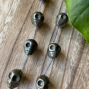 Shop Pyrite Bead Shapes! Pyrite skull bead strand, 12mm, fools gold, gemstone beads | Natural genuine other-shape Pyrite beads for beading and jewelry making.  #jewelry #beads #beadedjewelry #diyjewelry #jewelrymaking #beadstore #beading #affiliate #ad