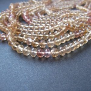 Imperial topaz rondelles • AAA micro faceted • 2.75-4.25mm • Natural genuine gemstone rondelle beads • Light peach pink champagne | Natural genuine faceted Topaz beads for beading and jewelry making.  #jewelry #beads #beadedjewelry #diyjewelry #jewelrymaking #beadstore #beading #affiliate #ad