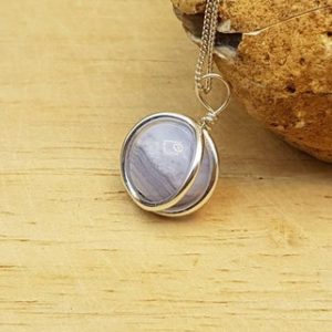 Shop Blue Lace Agate Jewelry! Small Blue lace agate circle pendant necklace. Minimalist Reiki jewelry uk. Pisces jewelry. Sterling silver sphere necklace. | Natural genuine Blue Lace Agate jewelry. Buy crystal jewelry, handmade handcrafted artisan jewelry for women.  Unique handmade gift ideas. #jewelry #beadedjewelry #beadedjewelry #gift #shopping #handmadejewelry #fashion #style #product #jewelry #affiliate #ad