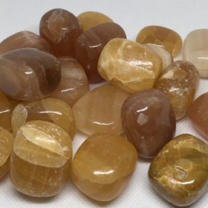 Shop Tumbled Calcite Crystals & Pocket Stones! Honey Calcite Tumbled Stone, Golden Honey Calcite, Citrine Color Calcite, Healing crystals and stones, Chakra Stones, Spiritual Stone | Natural genuine stones & crystals in various shapes & sizes. Buy raw cut, tumbled, or polished gemstones for making jewelry or crystal healing energy vibration raising reiki stones. #crystals #gemstones #crystalhealing #crystalsandgemstones #energyhealing #affiliate #ad