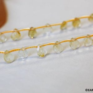 Shop Citrine Bead Shapes! S/ Citrine 7x5mm Flat Pear Briolette beads 16" strand abt 42pcs Shade varies Enhanced yellow quartz gemstone beads For jewelry making | Natural genuine other-shape Citrine beads for beading and jewelry making.  #jewelry #beads #beadedjewelry #diyjewelry #jewelrymaking #beadstore #beading #affiliate #ad