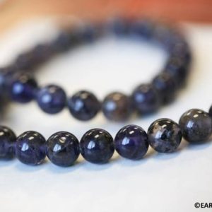 Shop Iolite Round Beads! M/ Iolite 8mm/ 6mm Smooth Round beads 15.5" strand Enhanced blue gemstone beads For jewelry making | Natural genuine round Iolite beads for beading and jewelry making.  #jewelry #beads #beadedjewelry #diyjewelry #jewelrymaking #beadstore #beading #affiliate #ad