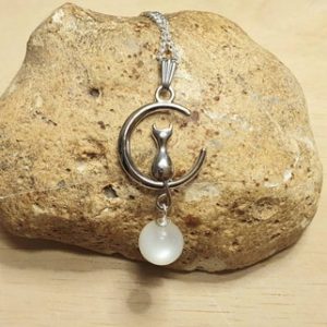 Shop Moonstone Pendants! Crescent moon Cat Moonstone Pendant. Crystal Reiki jewelry uk. June's Birthstone. White 10mm stone. Empowered crystals | Natural genuine Moonstone pendants. Buy crystal jewelry, handmade handcrafted artisan jewelry for women.  Unique handmade gift ideas. #jewelry #beadedpendants #beadedjewelry #gift #shopping #handmadejewelry #fashion #style #product #pendants #affiliate #ad