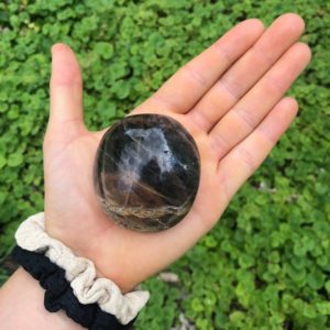 Shop Stone Spheres, Hearts & Other Shapes! Black moonstone Palm Stone, Polished Gemstone | Natural genuine stones & crystals in various shapes & sizes. Buy raw cut, tumbled, or polished gemstones for making jewelry or crystal healing energy vibration raising reiki stones. #crystals #gemstones #crystalhealing #crystalsandgemstones #energyhealing #affiliate #ad