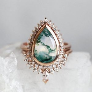 Shop Moss Agate Jewelry! Moss agate engagement ring set, Pear gemstone set, Vintage mossy bridal halo ring | Natural genuine Moss Agate jewelry. Buy handcrafted artisan wedding jewelry.  Unique handmade bridal jewelry gift ideas. #jewelry #beadedjewelry #gift #crystaljewelry #shopping #handmadejewelry #wedding #bridal #jewelry #affiliate #ad