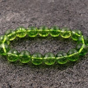 Shop Peridot Bracelets! Peridot Bracelet, Peridot Bracelet 10 mm, Beads, Peridot, Bracelets, Metaphysical Crystals, Gifts, Crystals, Gemstones, Gems, Stones, Rocks | Natural genuine Peridot bracelets. Buy crystal jewelry, handmade handcrafted artisan jewelry for women.  Unique handmade gift ideas. #jewelry #beadedbracelets #beadedjewelry #gift #shopping #handmadejewelry #fashion #style #product #bracelets #affiliate #ad