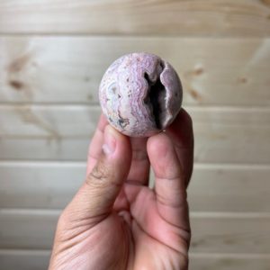 Shop Rhodochrosite Shapes! Rhodochrosite sphere (Argentina) | Natural genuine stones & crystals in various shapes & sizes. Buy raw cut, tumbled, or polished gemstones for making jewelry or crystal healing energy vibration raising reiki stones. #crystals #gemstones #crystalhealing #crystalsandgemstones #energyhealing #affiliate #ad