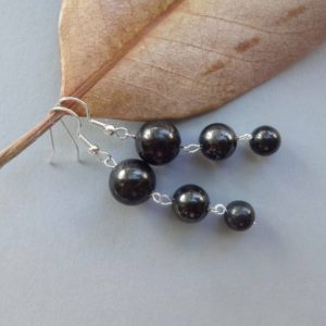 Shop Shungite Earrings! Shungite Stone Dangle Earrings for Women, 8-10-12 mm Black Beads, Silwer Plated Earwire, Spiritual Chakra Healing Trendy Jewelry | Natural genuine Shungite earrings. Buy crystal jewelry, handmade handcrafted artisan jewelry for women.  Unique handmade gift ideas. #jewelry #beadedearrings #beadedjewelry #gift #shopping #handmadejewelry #fashion #style #product #earrings #affiliate #ad