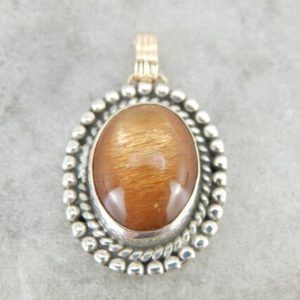 Shop Sunstone Pendants! Glittering Orange Sunstone Pendant in Sterling and Gold Frame H11Q3K | Natural genuine Sunstone pendants. Buy crystal jewelry, handmade handcrafted artisan jewelry for women.  Unique handmade gift ideas. #jewelry #beadedpendants #beadedjewelry #gift #shopping #handmadejewelry #fashion #style #product #pendants #affiliate #ad