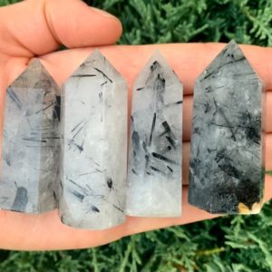 Shop Tourmalinated Quartz Points & Wands! Tourmalinated Quartz Point | Black Tourmaline in Quartz | Natural genuine stones & crystals in various shapes & sizes. Buy raw cut, tumbled, or polished gemstones for making jewelry or crystal healing energy vibration raising reiki stones. #crystals #gemstones #crystalhealing #crystalsandgemstones #energyhealing #affiliate #ad