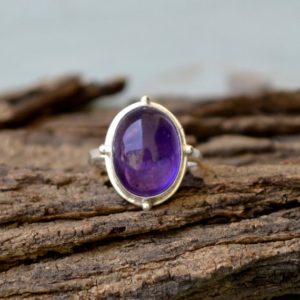 Shop Amethyst Rings! Natural Purple Amethyst Gemstone Ring- February Birthstone Ring- Oval Cabochon Ring- 925 Sterling Silver Ring- Purple Amethyst Gift Ring | Natural genuine Amethyst rings, simple unique handcrafted gemstone rings. #rings #jewelry #shopping #gift #handmade #fashion #style #affiliate #ad