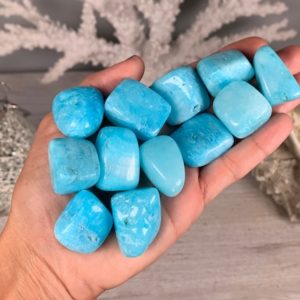Shop Tumbled Aragonite Crystals & Pocket Stones! Blue Aragonite, Tumbled Blue Aragonite, Blue Aragonite Crystal, Has Been DYED, Naturally Pitted and Porous | Natural genuine stones & crystals in various shapes & sizes. Buy raw cut, tumbled, or polished gemstones for making jewelry or crystal healing energy vibration raising reiki stones. #crystals #gemstones #crystalhealing #crystalsandgemstones #energyhealing #affiliate #ad