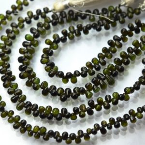 Shop Green Tourmaline Beads! 7 Inch strand, Natural Green Tourmaline Smooth Drops. 4-5mm | Natural genuine other-shape Green Tourmaline beads for beading and jewelry making.  #jewelry #beads #beadedjewelry #diyjewelry #jewelrymaking #beadstore #beading #affiliate #ad